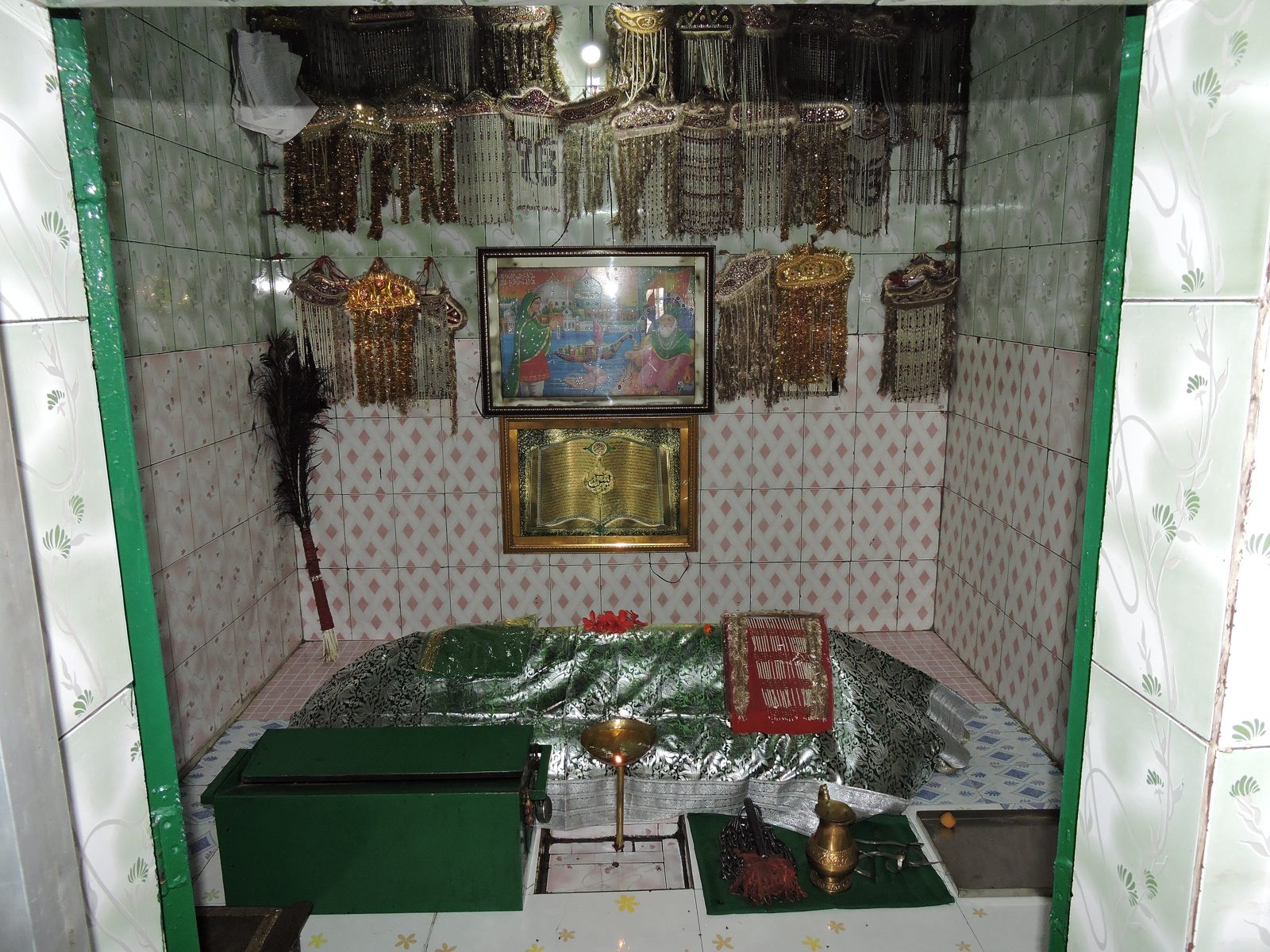 Draped shrine of the pirs inside the dargah